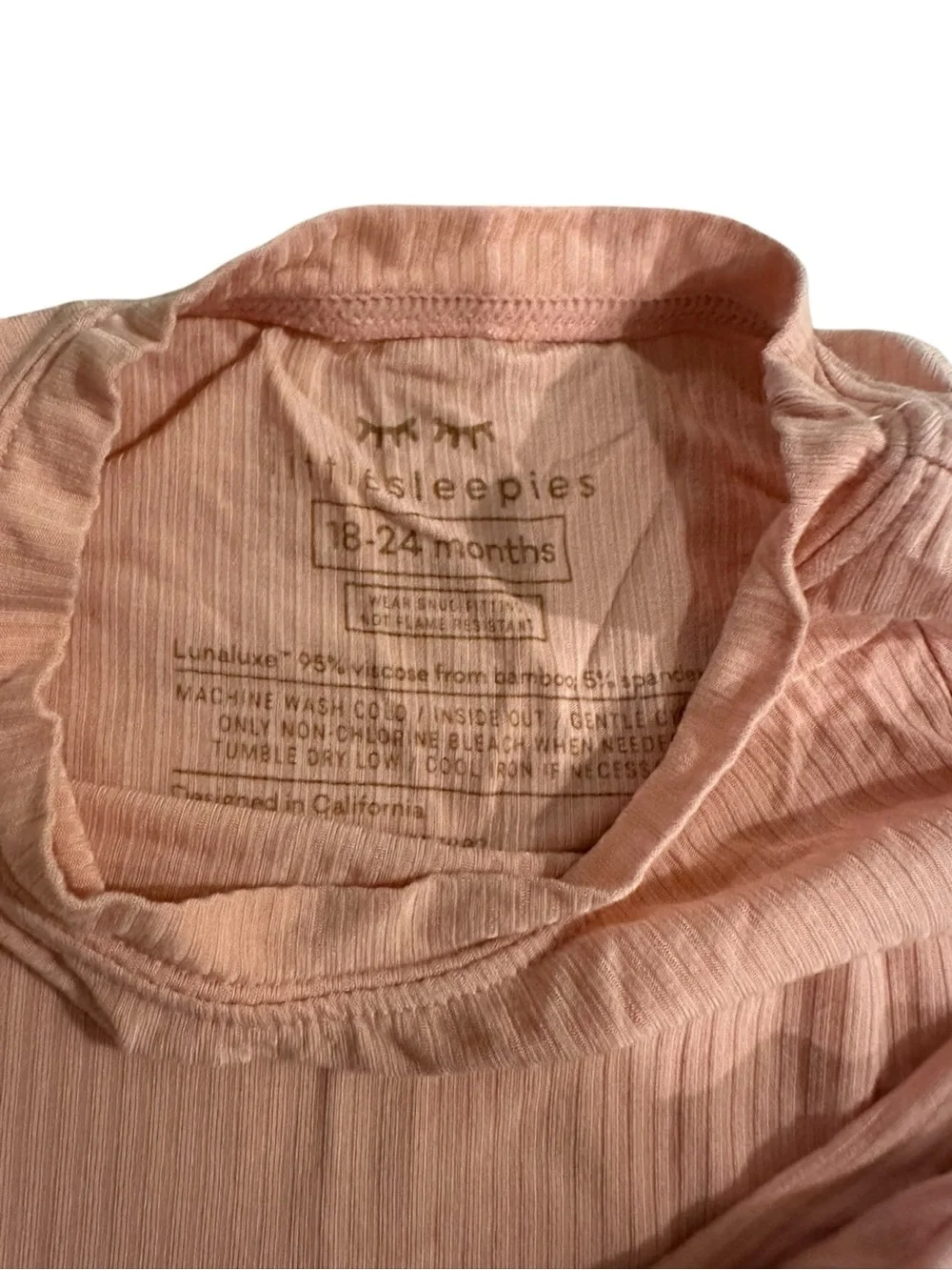 This Little Sleepies pajama set is made from pink ribbed bamboo fabric.